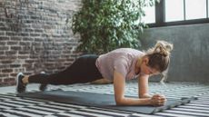 A woman performing a plank